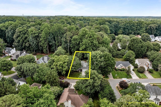 8700 Fox Tail Ln, Huntersville, NC 28078 - aerial view of residential area featuring a forest and property parcel outlined
