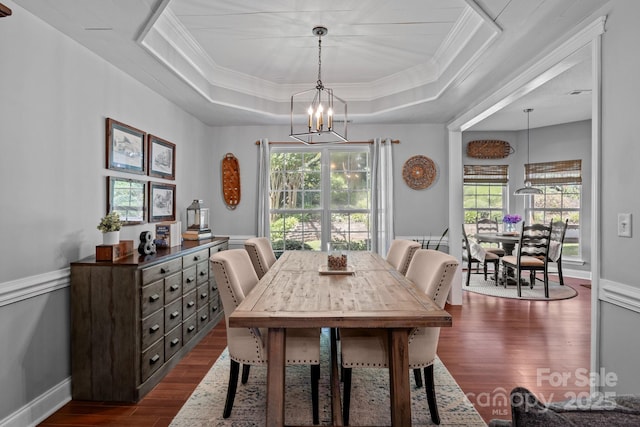 8700 Fox Tail Ln, Huntersville, NC 28078 - dining space with a tray ceiling, dark wood-style floors, ornamental molding, plenty of natural light, and a chandelier