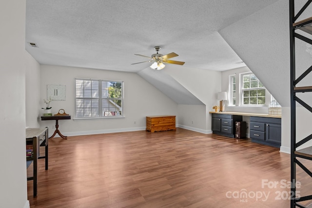 8700 Fox Tail Ln, Huntersville, NC 28078 - bonus room with wood finished floors, a ceiling fan, a textured ceiling, and lofted ceiling
