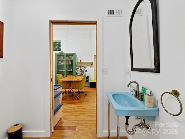 59 Alexander Rd, Weaverville, NC 28787 - bathroom featuring wood finished floors and a sink