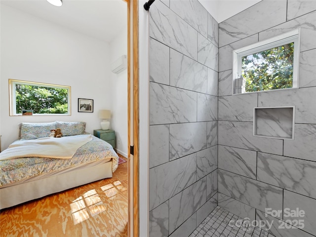 59 Alexander Rd, Weaverville, NC 28787 - bedroom featuring multiple windows, wood finished floors, and a wall mounted AC