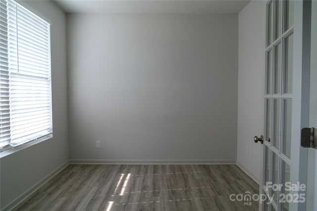 69 Ravibha Ct, Clayton, NC 27520 - empty room with wood finished floors and baseboards