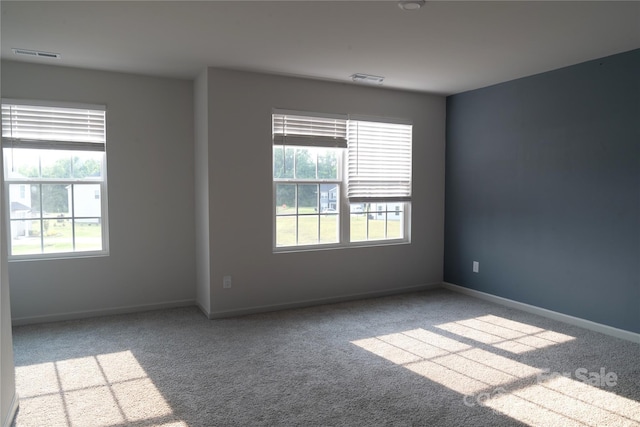 69 Ravibha Ct, Clayton, NC 27520 - carpeted spare room featuring baseboards