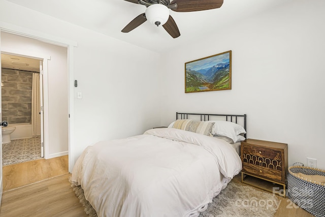 487 Duncan Creek Rd, Fletcher, NC 28732 - bedroom featuring light wood-style flooring, a ceiling fan, and ensuite bathroom