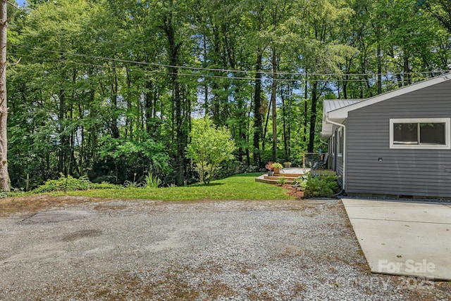 487 Duncan Creek Rd, Fletcher, NC 28732 - view of yard featuring a wooden deck and view of scattered trees