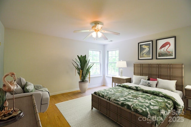 12314 Chickasaw Dr, Huntersville, NC 28078 - bedroom with a ceiling fan and light wood-style flooring