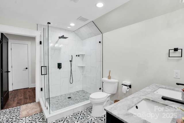 316 Wade Hampton Dr, Matthews, NC 28104 - bathroom with double vanity, recessed lighting, a shower stall, toilet, and tile patterned floors