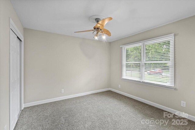 5811 Gettysburg Dr, Concord, NC 28027 - unfurnished bedroom with carpet floors, a closet, and ceiling fan