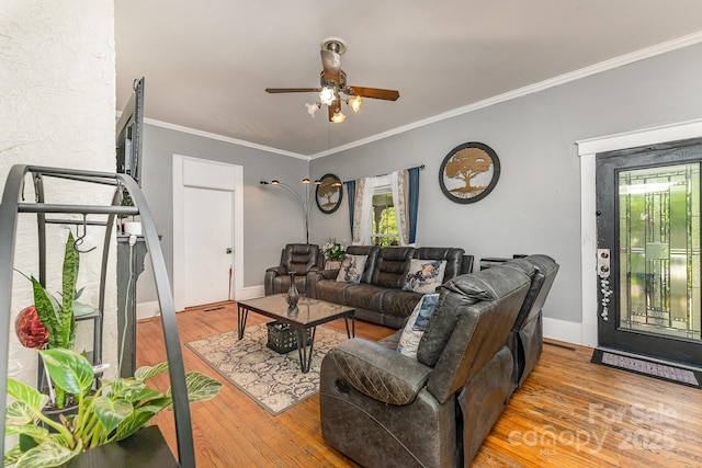 300 S Hudson Ave, Spencer, NC 28159 - living room featuring a ceiling fan, wood finished floors, and ornamental molding