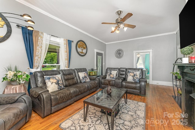 300 S Hudson Ave, Spencer, NC 28159 - living room featuring a ceiling fan, wood finished floors, and ornamental molding