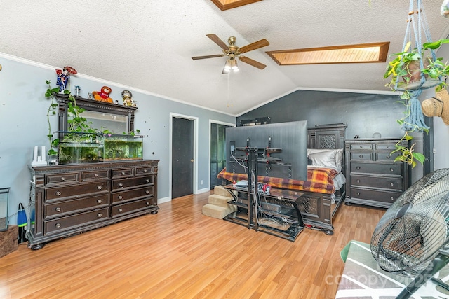 300 S Hudson Ave, Spencer, NC 28159 - bedroom featuring wood finished floors, a skylight, vaulted ceiling, a textured ceiling, and crown molding