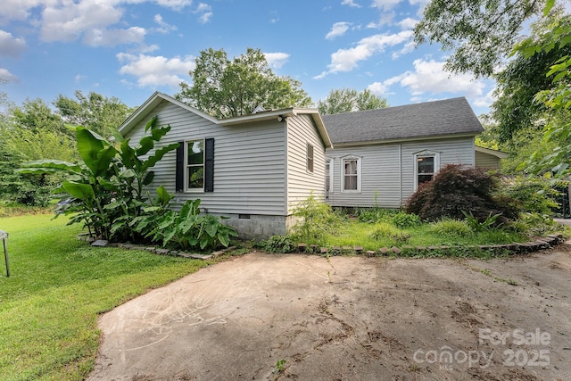300 S Hudson Ave, Spencer, NC 28159 - view of side of property featuring a lawn, a patio, and crawl space