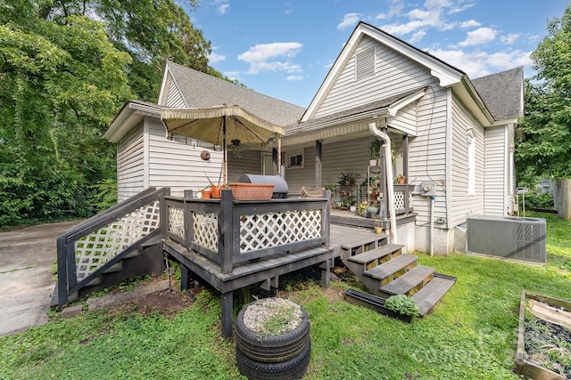300 S Hudson Ave, Spencer, NC 28159 - back of property featuring a shingled roof and a lawn