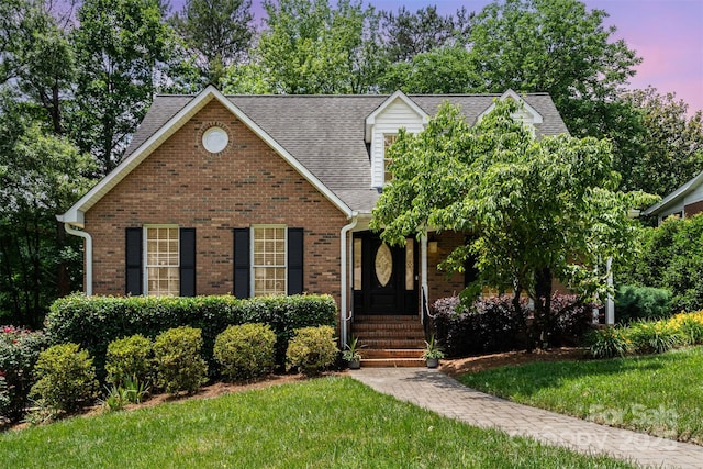 139 Palaside Dr NE, Concord, NC 28025 - view of front facade with a front lawn, brick siding, and a shingled roof