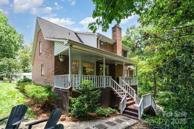 139 Palaside Dr NE, Concord, NC 28025 - view of front of home featuring a ceiling fan, covered porch, brick siding, and a chimney