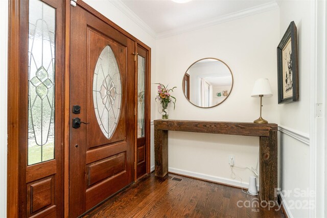 139 Palaside Dr NE, Concord, NC 28025 - foyer entrance featuring dark wood finished floors and ornamental molding