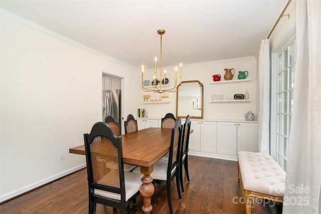 139 Palaside Dr NE, Concord, NC 28025 - dining room with a chandelier, crown molding, and dark wood finished floors