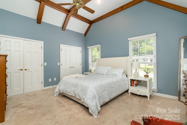 139 Palaside Dr NE, Concord, NC 28025 - carpeted bedroom with two closets, beam ceiling, high vaulted ceiling, and ceiling fan