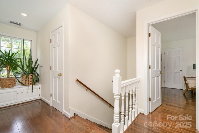 139 Palaside Dr NE, Concord, NC 28025 - corridor with an upstairs landing, dark wood-style floors, and recessed lighting
