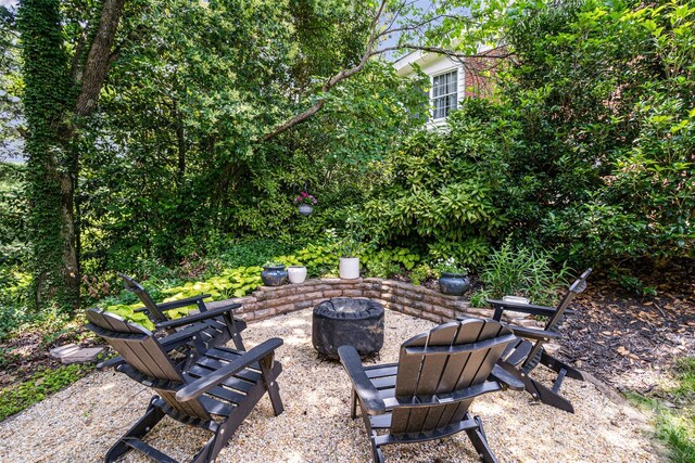 139 Palaside Dr NE, Concord, NC 28025 - view of patio with a fire pit