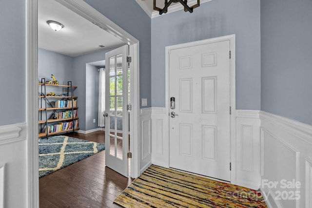 1569 Shannon Falls Dr, Fort Mill, SC 29715 - entryway with a wainscoted wall, wood finished floors, a chandelier, and a decorative wall