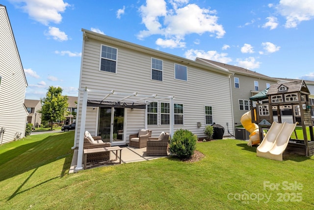 1569 Shannon Falls Dr, Fort Mill, SC 29715 - rear view of property featuring a pergola, a playground, a lawn, a patio, and an outdoor hangout area