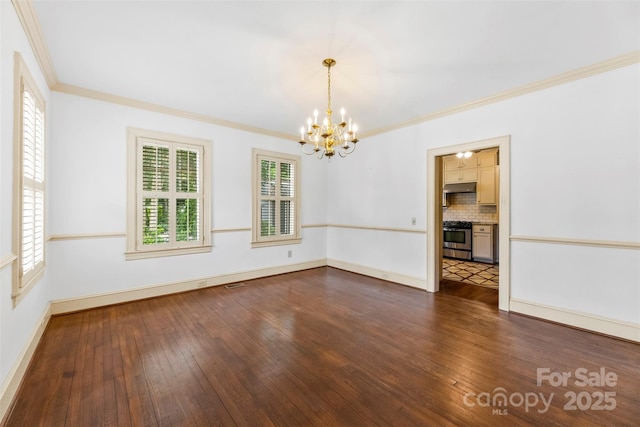 805 S Main St, Mount Holly, NC 28120 - empty room with a chandelier, dark wood finished floors, and ornamental molding