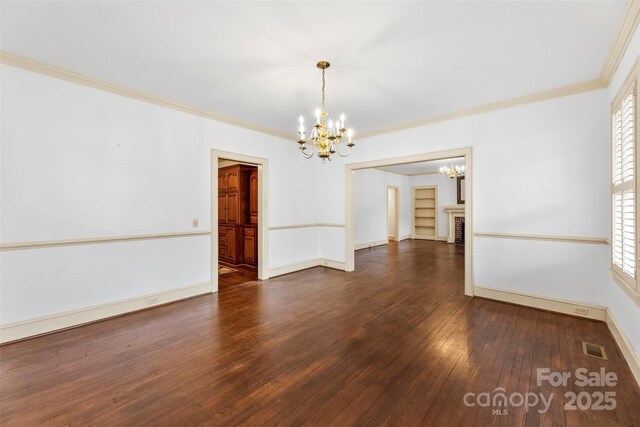 805 S Main St, Mount Holly, NC 28120 - empty room featuring a chandelier, hardwood / wood-style flooring, and crown molding