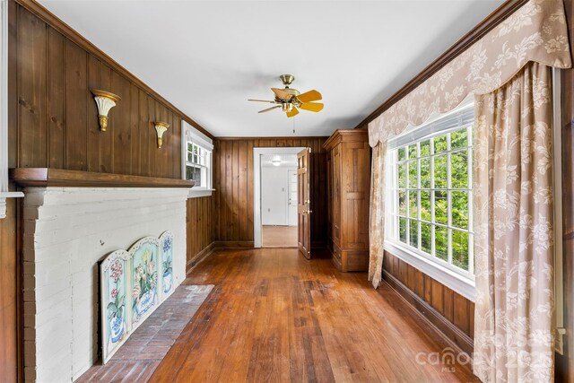 805 S Main St, Mount Holly, NC 28120 - corridor with ornamental molding, wood walls, and wood finished floors