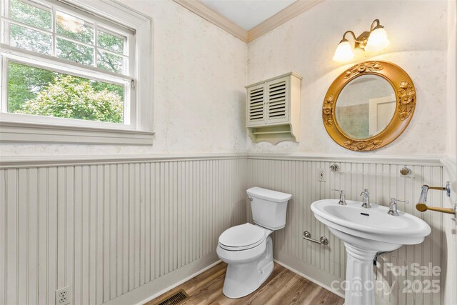 805 S Main St, Mount Holly, NC 28120 - half bathroom featuring wood finished floors and crown molding