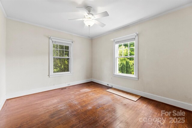 805 S Main St, Mount Holly, NC 28120 - unfurnished room featuring wood finished floors, ornamental molding, and a ceiling fan