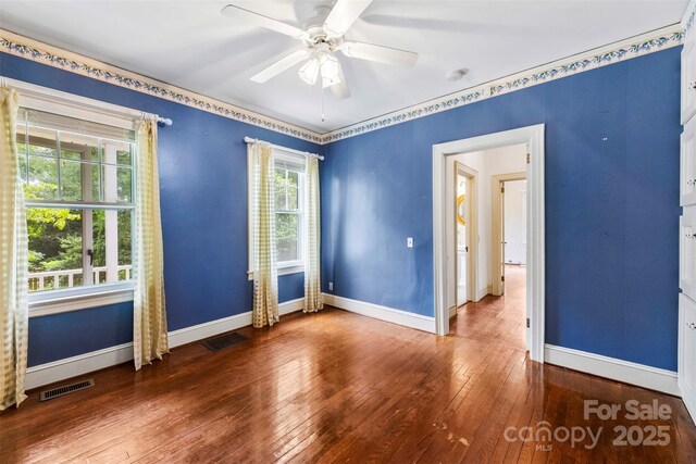 805 S Main St, Mount Holly, NC 28120 - spare room featuring hardwood / wood-style floors, ceiling fan, and a smoke detector
