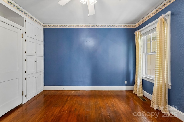 805 S Main St, Mount Holly, NC 28120 - empty room featuring dark wood finished floors and ceiling fan