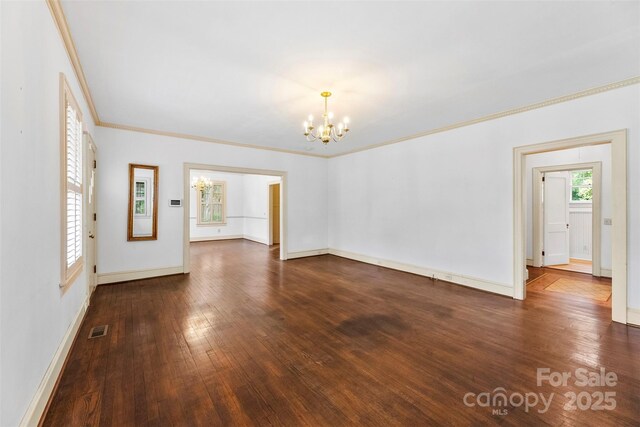 805 S Main St, Mount Holly, NC 28120 - unfurnished room featuring a chandelier, hardwood / wood-style floors, and crown molding