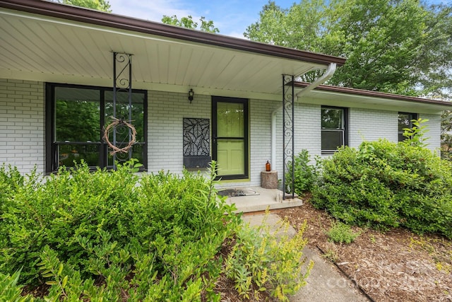 20 Summit Dr, Arden, NC 28704 - doorway to property featuring brick siding and a porch