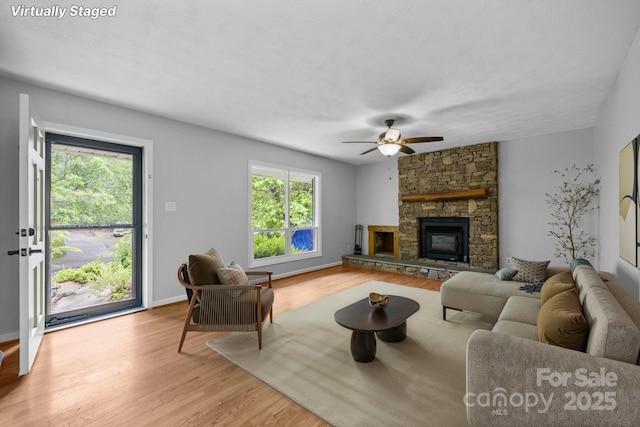 20 Summit Dr, Arden, NC 28704 - living area with light wood finished floors, a ceiling fan, and a fireplace