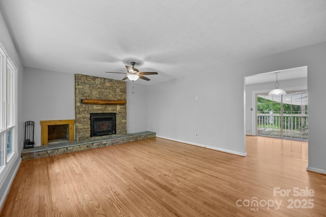 20 Summit Dr, Arden, NC 28704 - unfurnished living room featuring wood finished floors, ceiling fan, and a fireplace