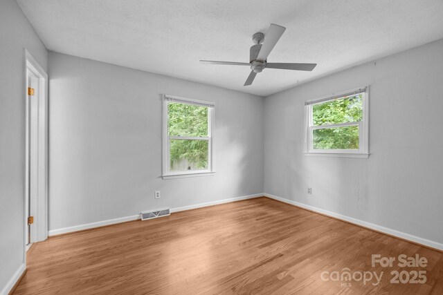 20 Summit Dr, Arden, NC 28704 - empty room with wood finished floors and ceiling fan