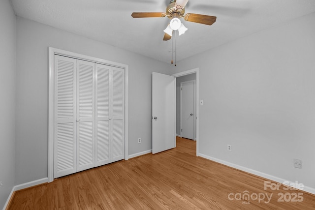20 Summit Dr, Arden, NC 28704 - unfurnished bedroom featuring wood finished floors, a closet, and ceiling fan