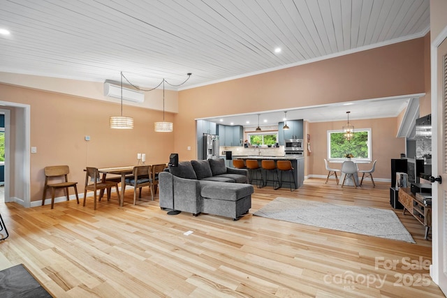 419 E Blue Ridge Rd, East Flat Rock, NC 28726 - living area with ornamental molding, light wood-style floors, an AC wall unit, and recessed lighting