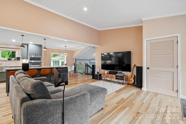 419 E Blue Ridge Rd, East Flat Rock, NC 28726 - living area featuring light wood-style flooring, crown molding, and recessed lighting