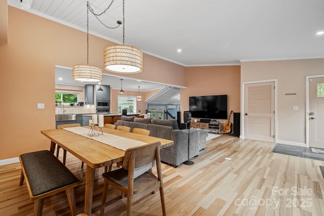 419 E Blue Ridge Rd, East Flat Rock, NC 28726 - dining area featuring light wood-type flooring, ornamental molding, and recessed lighting