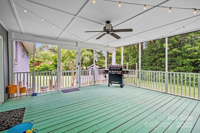 419 E Blue Ridge Rd, East Flat Rock, NC 28726 - unfurnished sunroom with ceiling fan and view of scattered trees