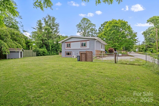 419 E Blue Ridge Rd, East Flat Rock, NC 28726 - fenced backyard featuring a gate and a shed