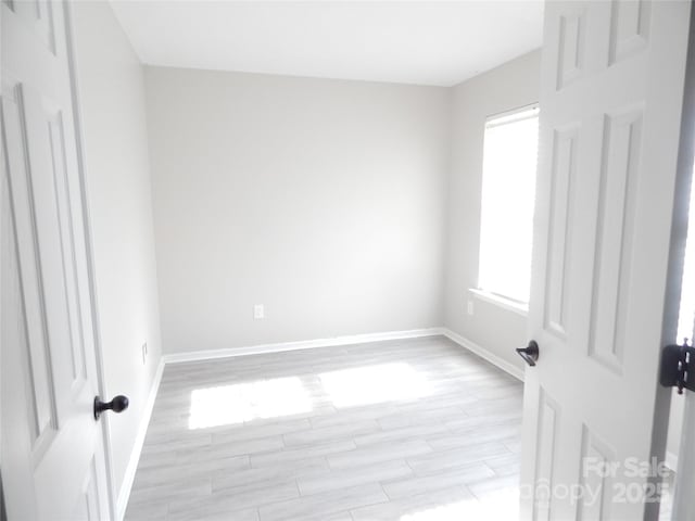 10615 Elm Bend Dr, Charlotte, NC 28273 - unfurnished room with baseboards and light wood-type flooring