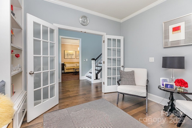 10203 Loch Lomond Dr, Charlotte, NC 28278 - living area with ornamental molding, wood finished floors, french doors, and stairway