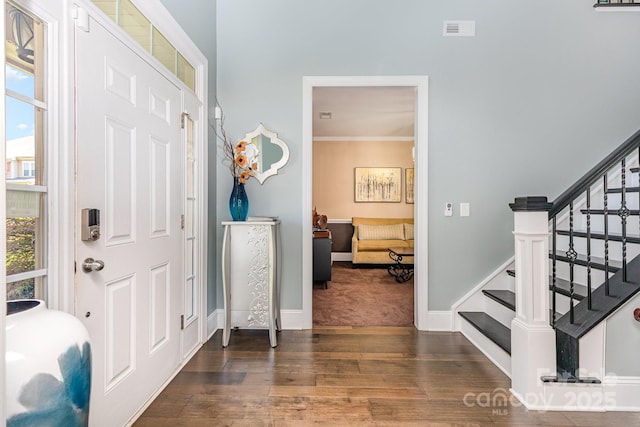 10203 Loch Lomond Dr, Charlotte, NC 28278 - foyer with wood finished floors, stairs, and crown molding