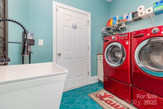10203 Loch Lomond Dr, Charlotte, NC 28278 - laundry room with washer and clothes dryer and cabinet space