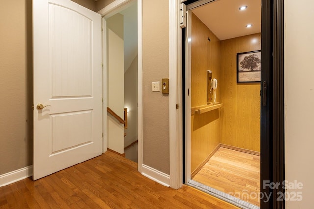 6 Grouse Ter, Fairview, NC 28730 - hall with elevator, an upstairs landing, wood finished floors, and recessed lighting