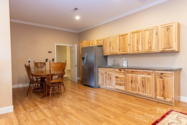 6 Grouse Ter, Fairview, NC 28730 - kitchen with stainless steel refrigerator with ice dispenser, light brown cabinets, ornamental molding, and light wood-type flooring